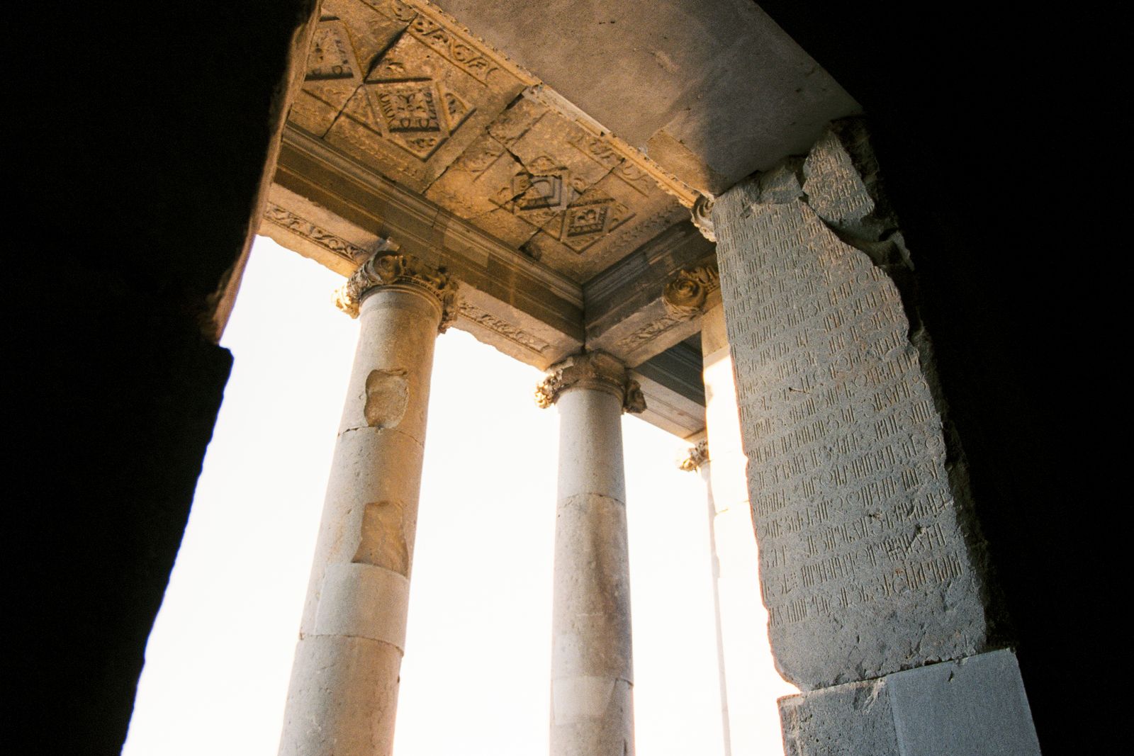 Ancient stone columns with detailed carvings