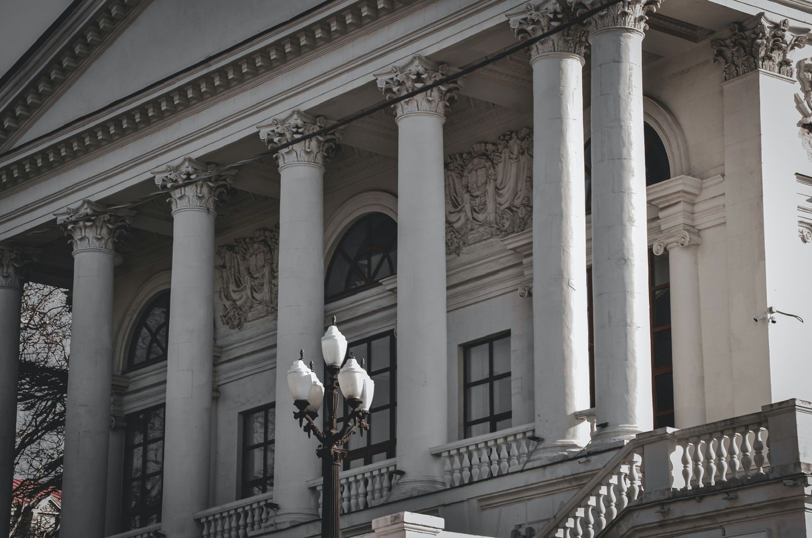 Neoclassical building facade with tall columns and intricate detailing